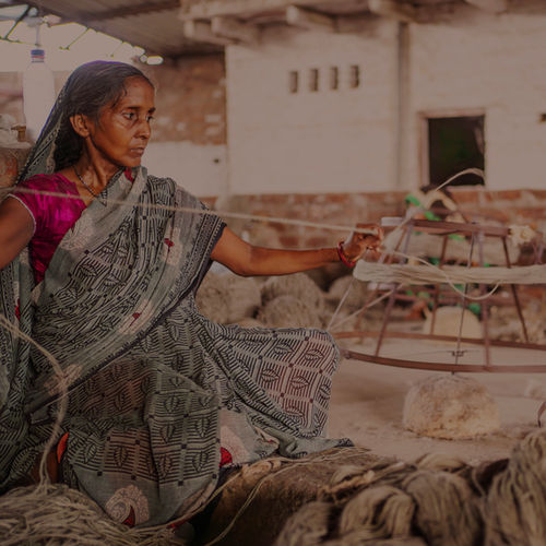 Artisan preparing yarn by hand