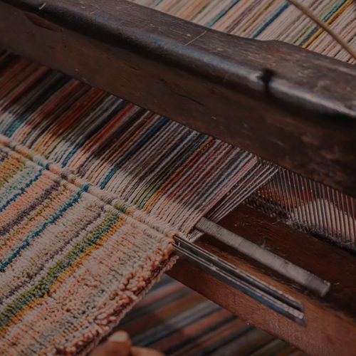 Colourful threads on a traditional weaving loom
